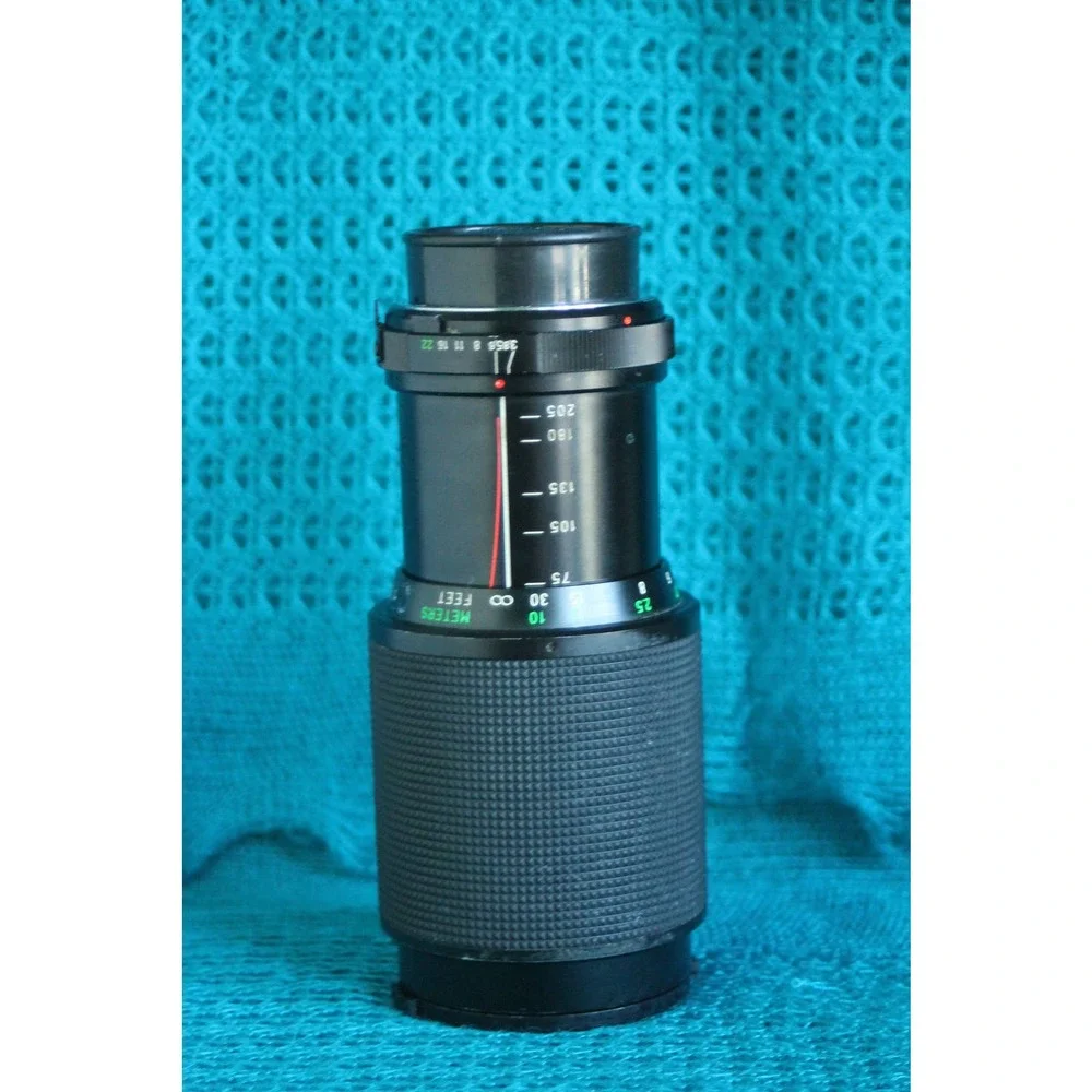 Vivitar 75-205 MM F1:3.8 Lens for Minolta MC mount with 2x converter.
